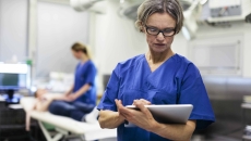 Doctor looking at tablet