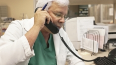 Healthcare professional on landline phone