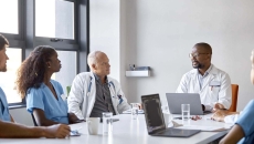 Medical professionals at conference table