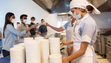 Cafeteria line with food service workers