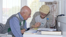 People going over papers at table