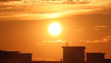 Sun rising over a city