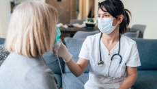 Nurse with patient in the home
