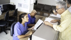 Patient asks receptionist for his medical records.