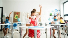 Children masked in a classroom. Photo: Halfpoint Images/Getty Images
