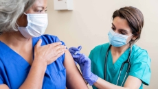 Healthcare professional administering vaccine