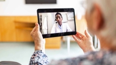 Person consults doctor via tablet