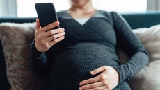 Pregnant woman on phone