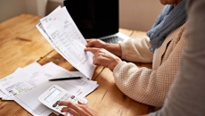 Two people go over paperwork