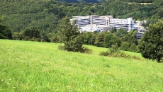 Hospital surrounded by fields and forests