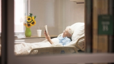 Patient in a hospital bed at home.