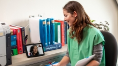 Healthcare worker talking to patient on tablet