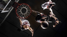 Basketball players driving to the basket on an unknown court