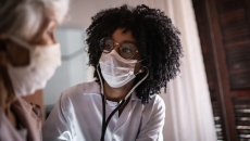 Nurse examines patient