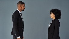 Two businesspeople face each other