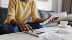 Woman using calculator