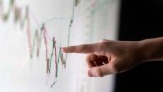 Finger pointing to a graph