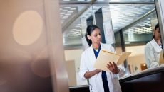 Health professional examining a chart