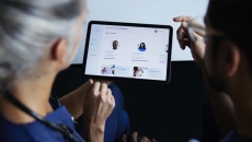 Doctor and patient examine tablet