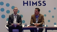 Matthew Fisher and Oliver Kim on stage at the HIMSS23 Global Conference in Chicago on Tuesday