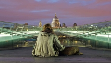 Homeless person with U.S. Capitol in the distance