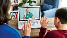 Parent and child attending telehealth appointment