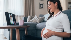 Pregnant woman attending telehealth appointment