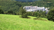 Hospital surrounded by fields and woods