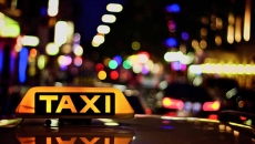 A taxi on a city street