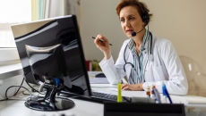 Doctor at computer screen