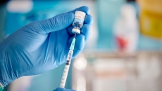 A vaccine shot is prepared