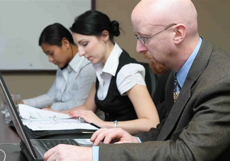 Three people working