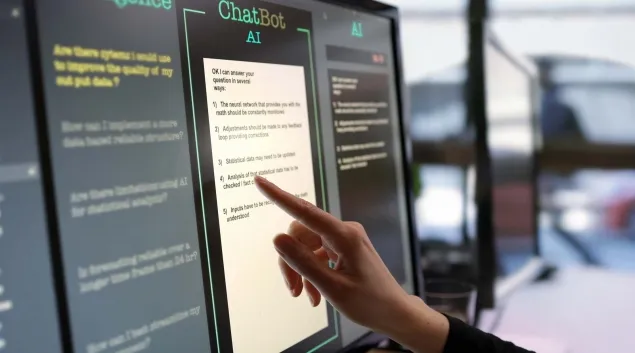 Finger pointing to a screen labeled ChatBot AI