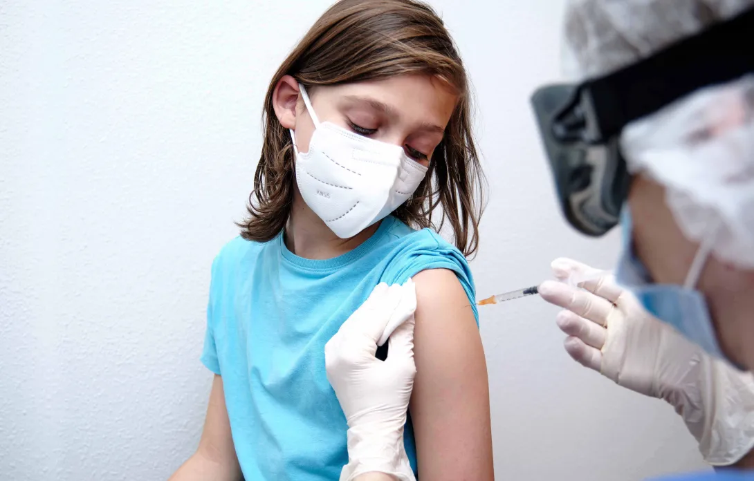 Child getting a vaccine Child getting a vaccine