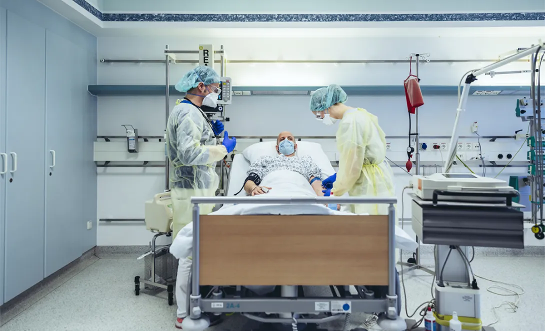 Medical professionals at hospital bed