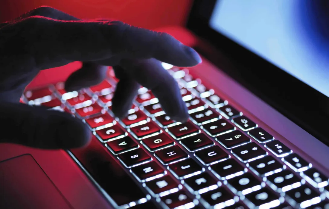 Hand on keyboard in the dark Hand on keyboard in the dark