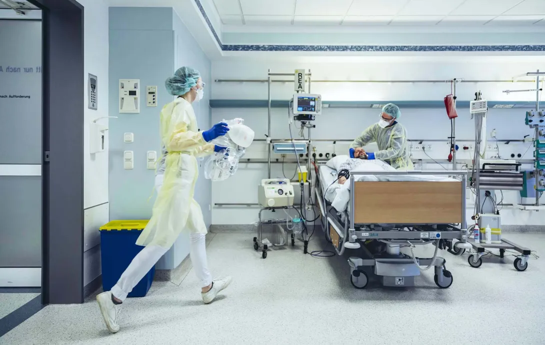 Hospital room with patient and caregiver Hospital room with patient and caregiver