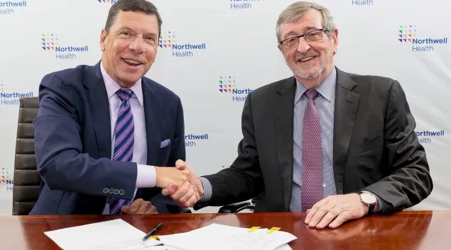 From left, John M. Murphy, MD, president and CEO of Nuvance Health, shakes hands with Northwell president and CEO Michael Dowling at a signing ceremony. From left, John M. Murphy, MD, president and CEO of Nuvance Health, shakes hands with Northwell president and CEO Michael Dowling at a signing ceremony.