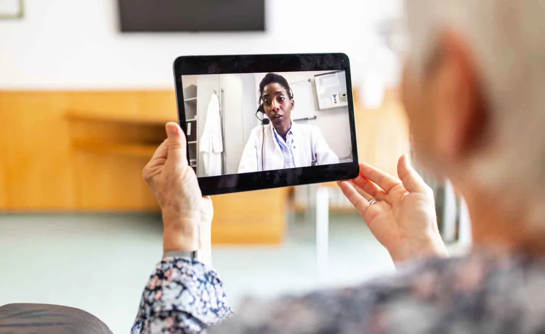 Person consults doctor via tablet Person consults doctor via tablet