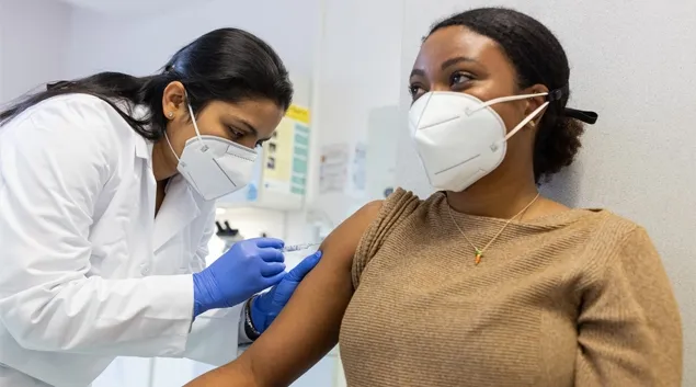 A vaccination. Photo: Luis Alvarez/Getty Images