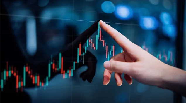 Hand pointing to numbers on a graph Hand pointing to numbers on a graph