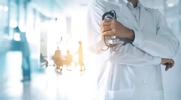 Person holding a stethoscope