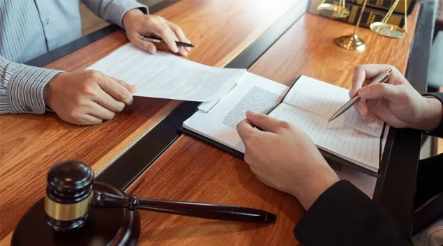Papers passed at a judge's bench