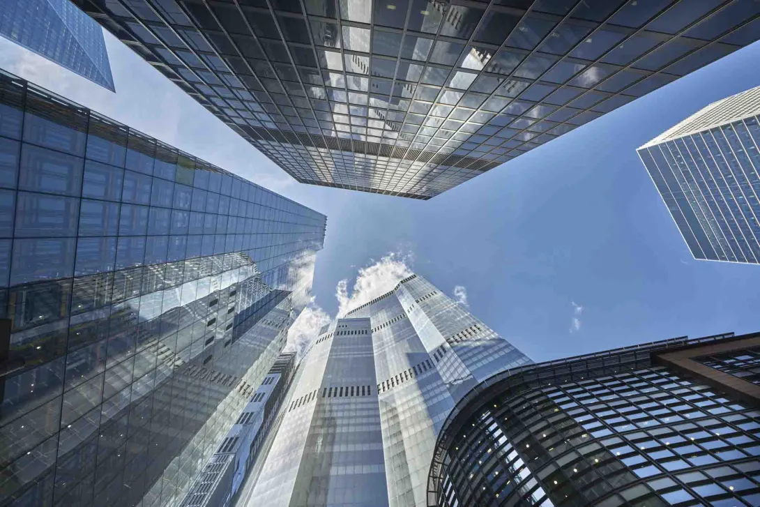 A group of skyscrapers and the sky from below A group of skyscrapers and the sky from below