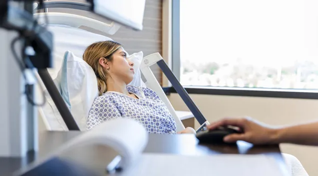 Patient in hospital bed Patient in hospital bed