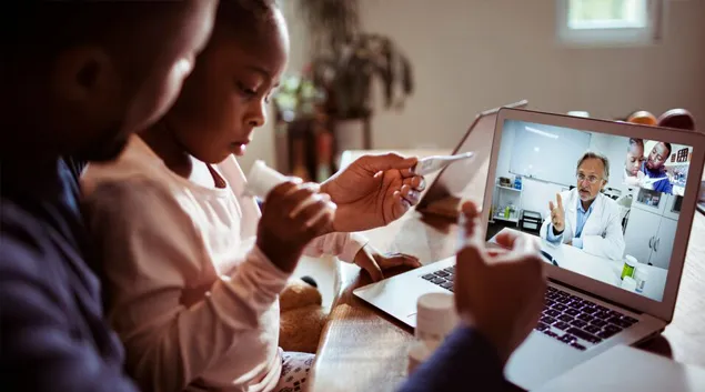 A telehealth visit with a doctor on screen