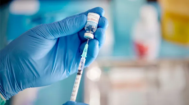 A vaccine shot is prepared