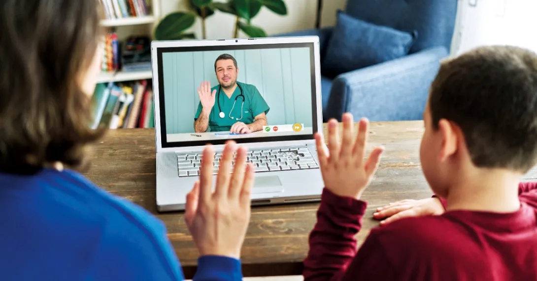 Parent and child waving to provider on laptop screen