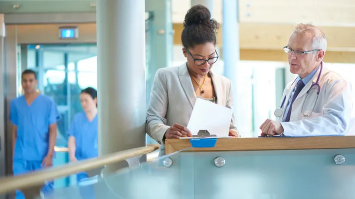 Doctor talking to nurse