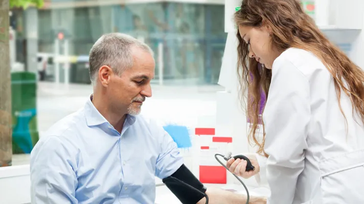 Doctor treating patient.